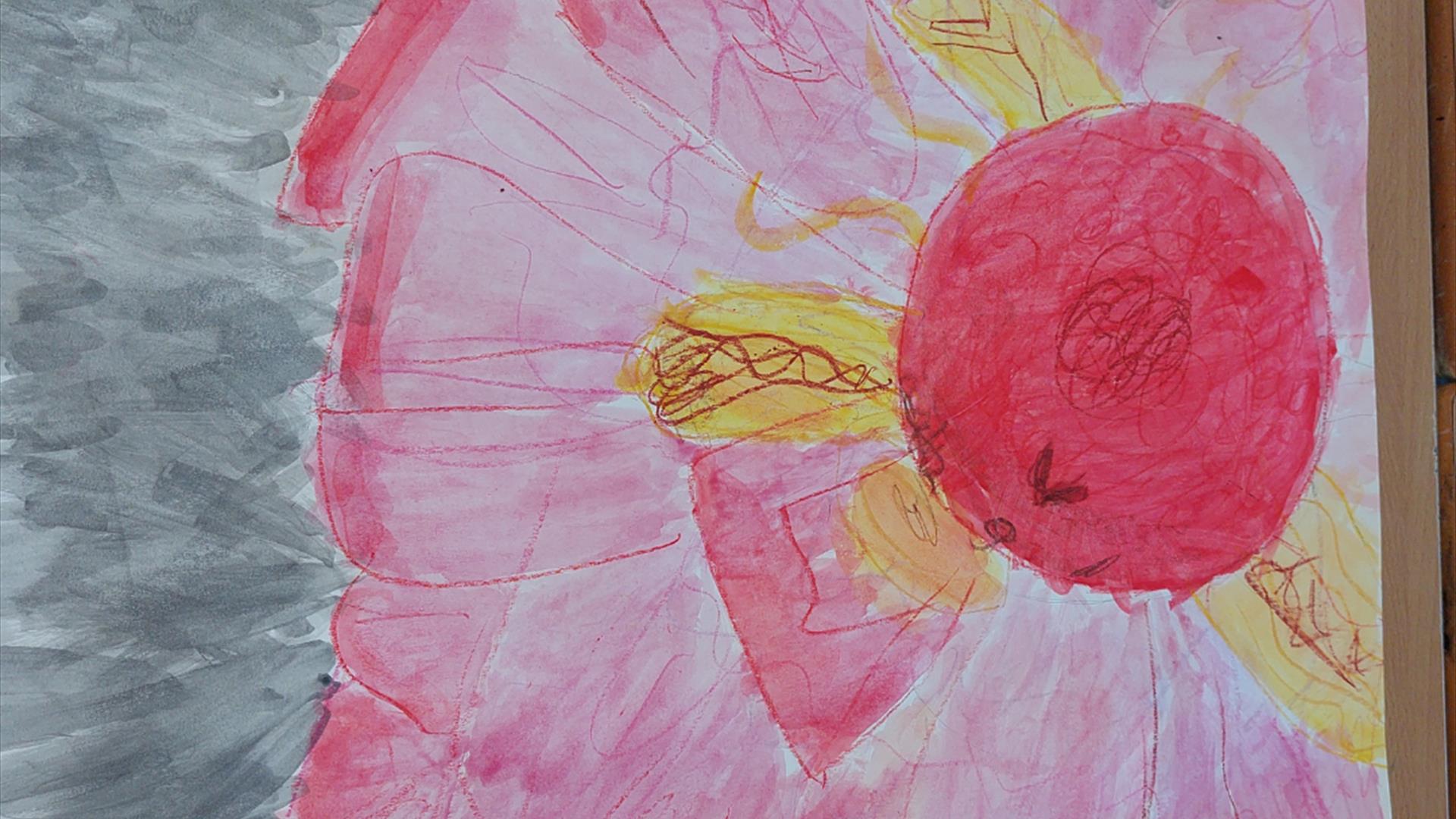 A large hand painted pink flower with some yellow petals.