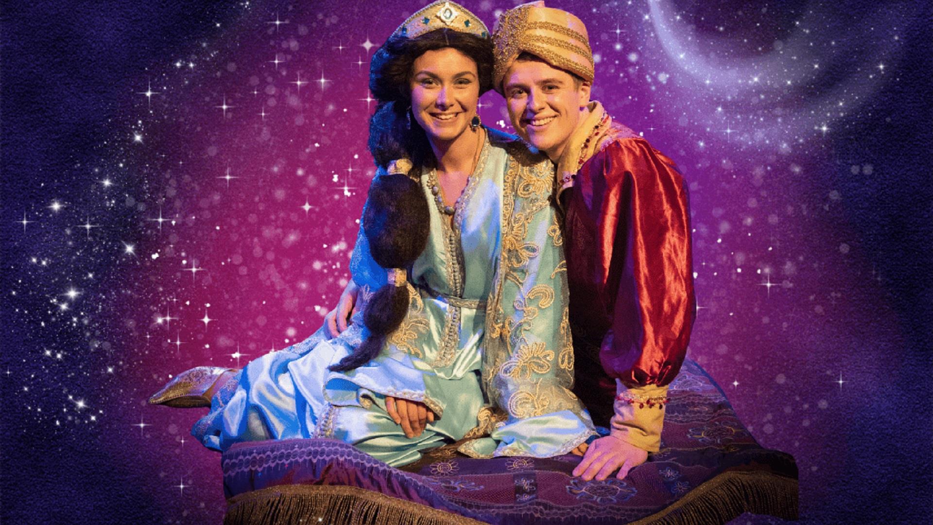 characters Jasmine and Aladdin sit on their magic carpet against a sparkly purple background