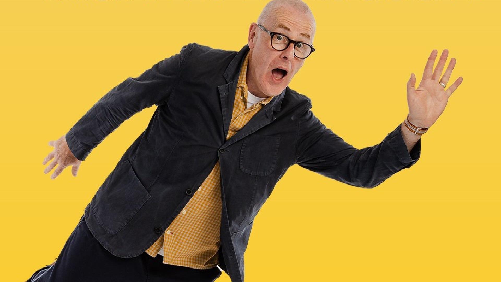 picture of colin murphy the comedian on a yellow background