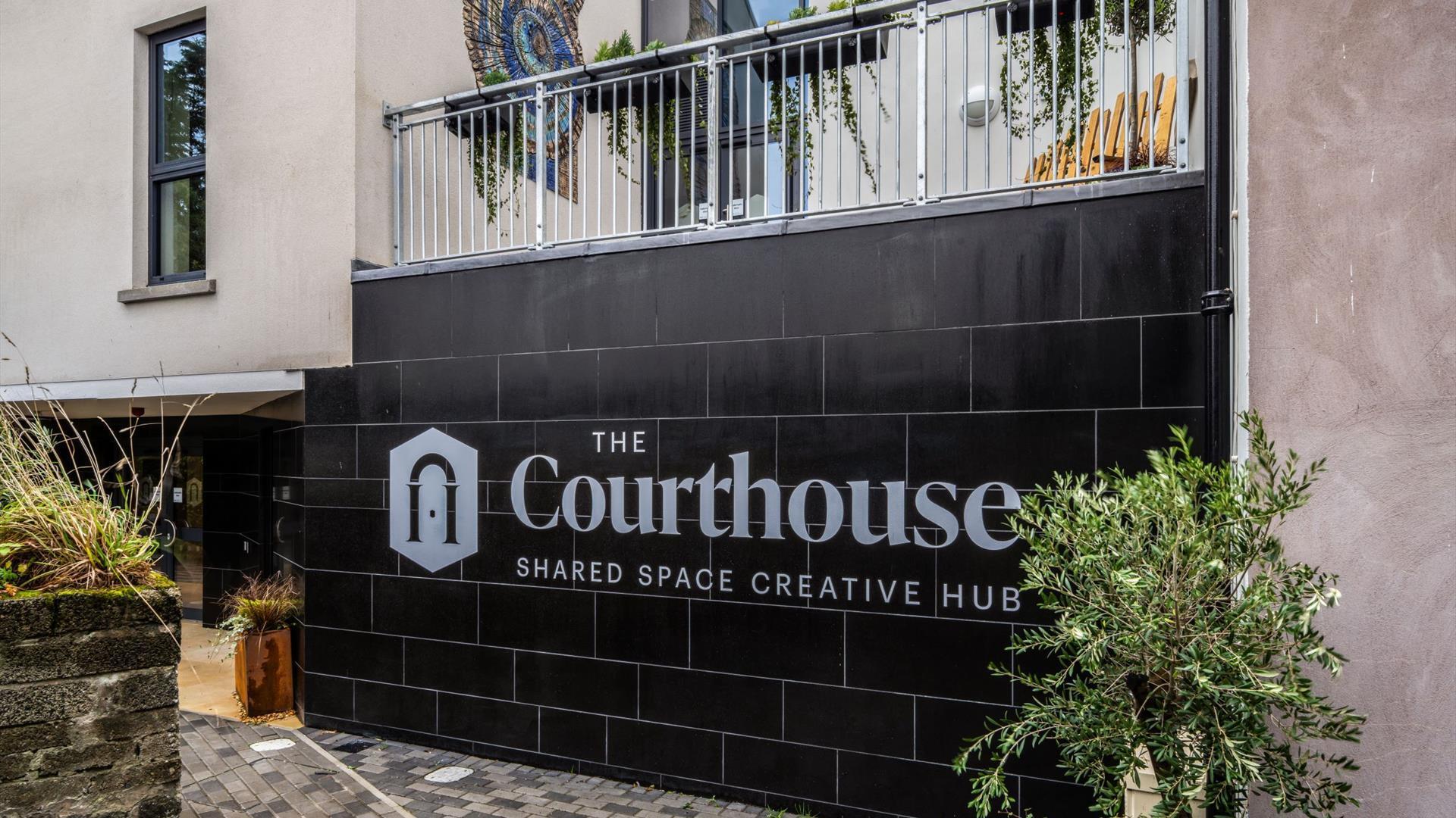 The Courthouse logo on a black tile wall, Bushmills.