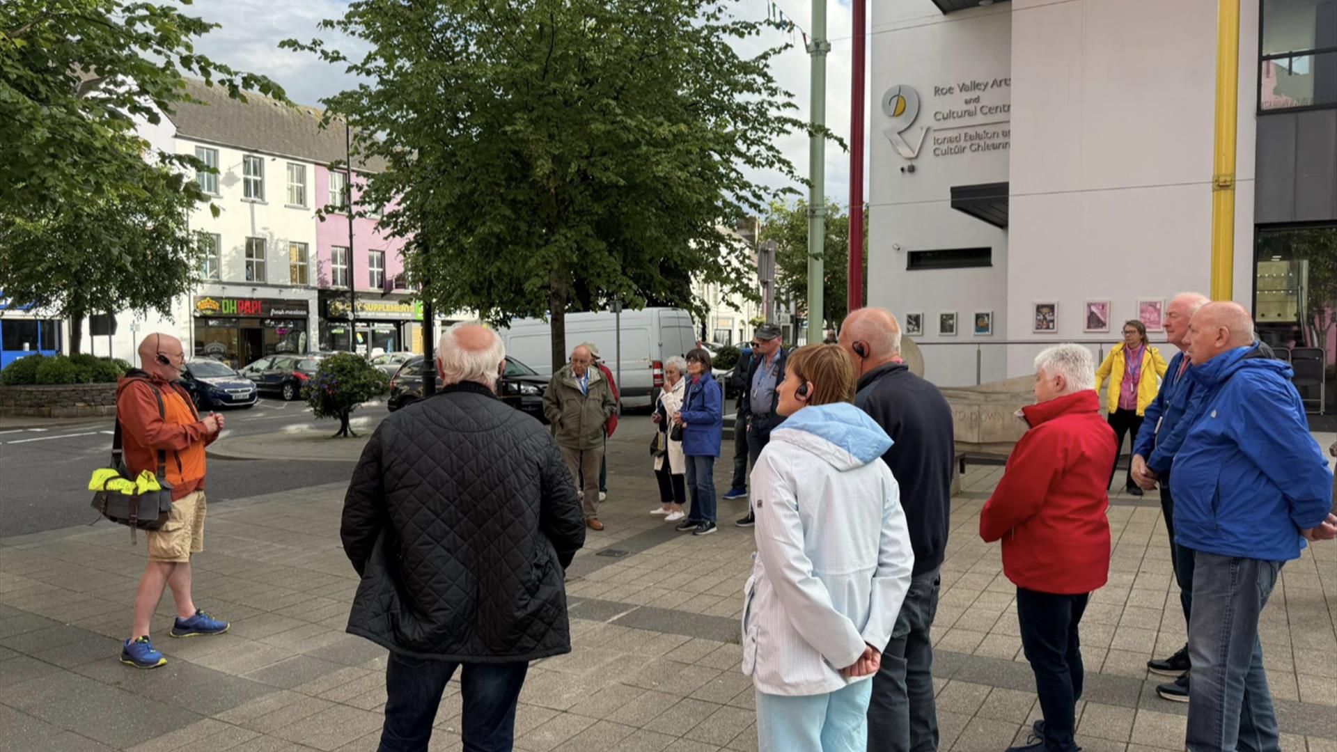 A tour group meeting with Sam at the Drumceatt square.