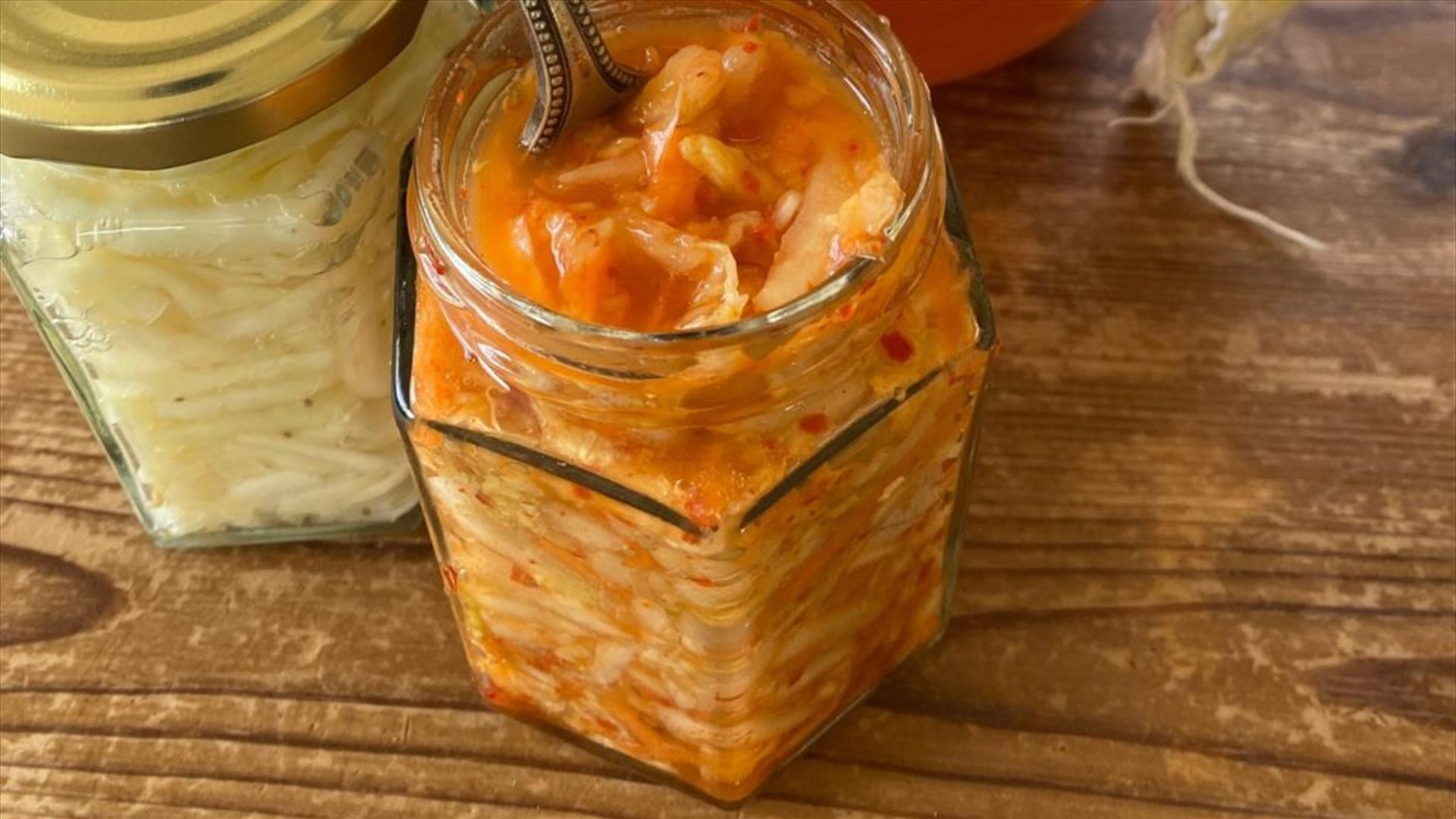 A glass jar filled with fermenting ingredients