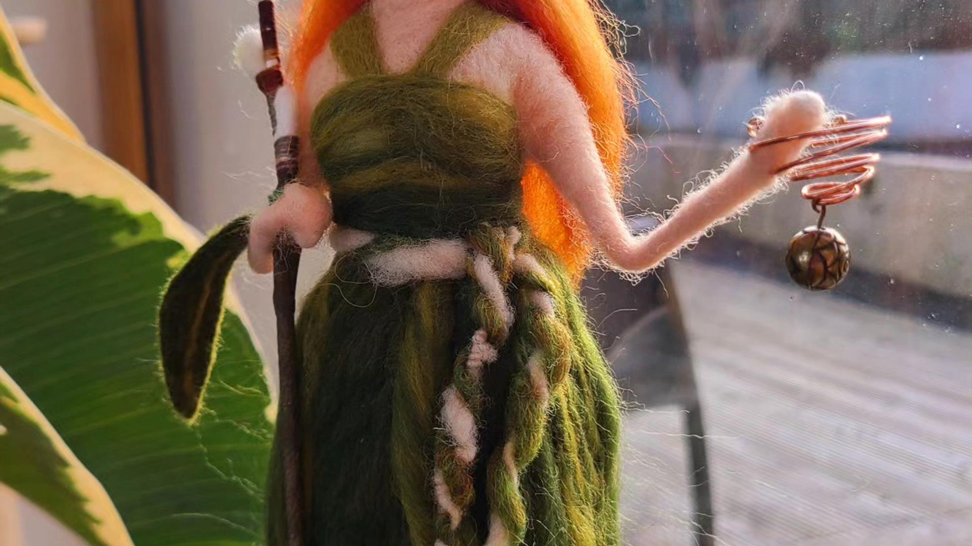 wool felted figure of a woman with red hair