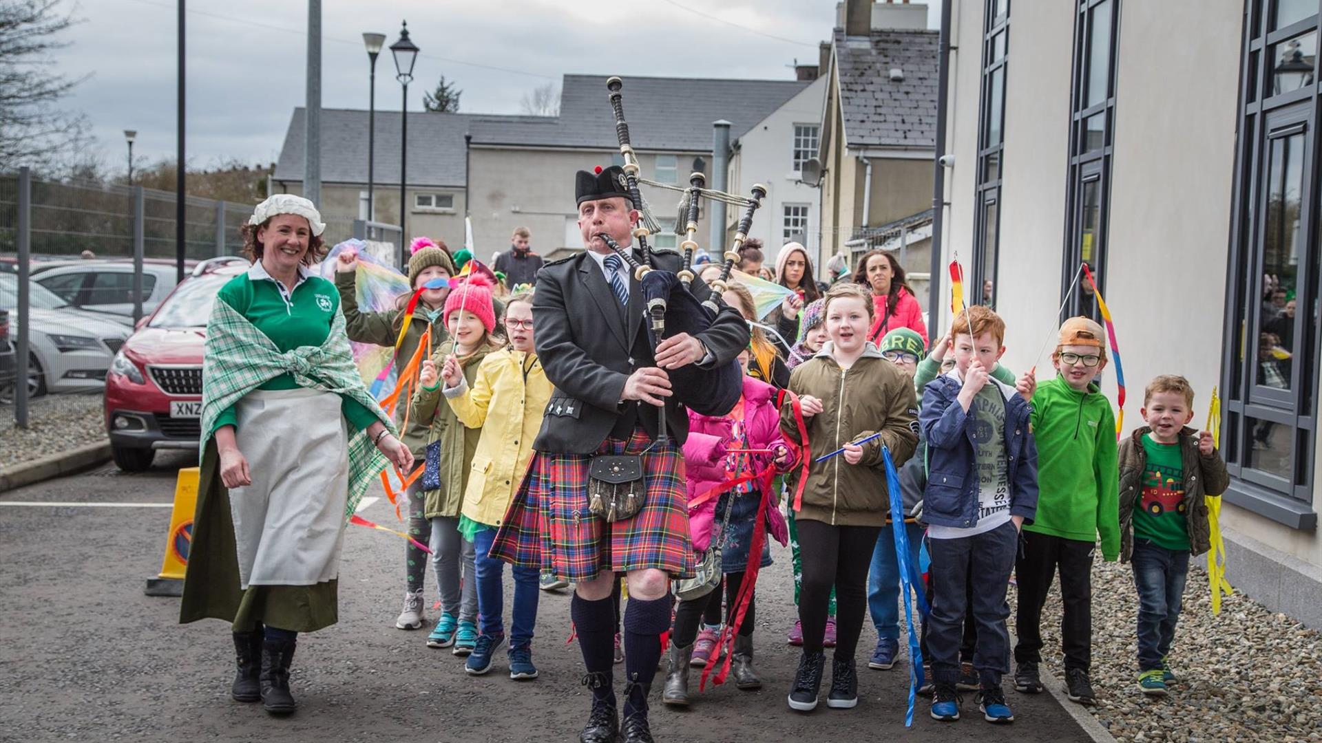 Ballycastle Community Parade led by a piper  in St Patrick's day 2018