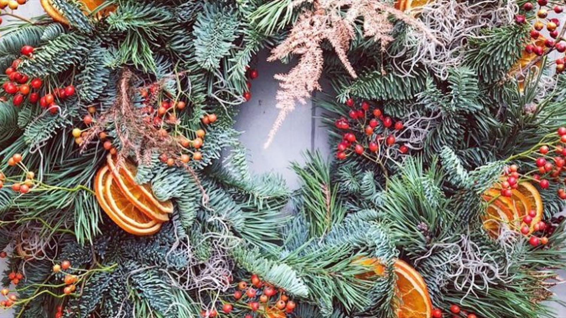 a festive Christmas wreath decorated with winter foliage