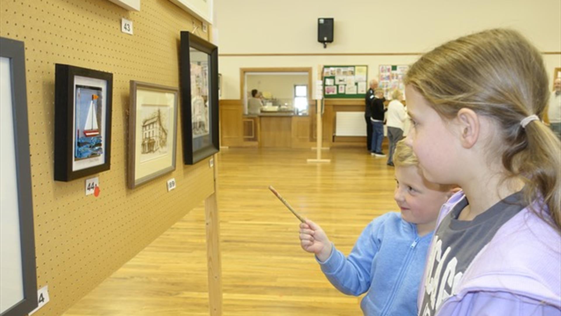 Children examining the exhibition space