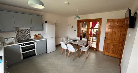 interior of kitchen and dining area at Primrose Seaside Escape