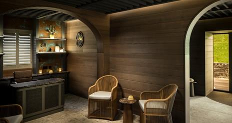 wooden chairs in the reception area of Dunluce Lodge Spa