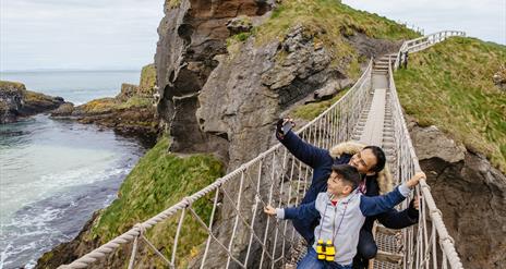 Father and Son on Carrick-a-Rede Rope Bridge taking a selfie