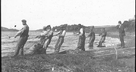 an old photograph of fishermen