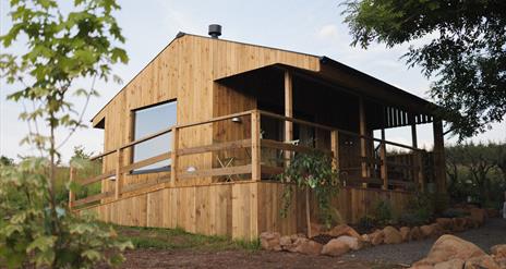 Picture of the Hideaway cabin and the veranda at the front of the cabin.