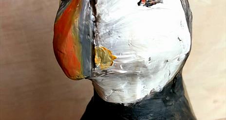 A hand sculpted puffin.