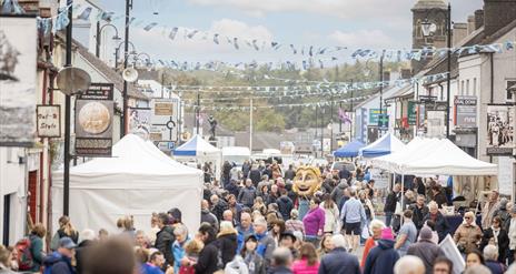 Crowds and stalls fill the main street in Bushmills
