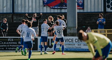 Coleraine FC celebrating on the pitch.