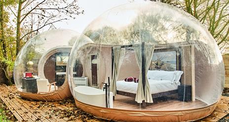 Premium bubble dome featuring a four posted bed and bath