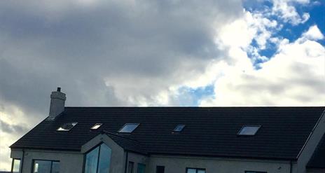 Image showing the top of a bungalow and the sky