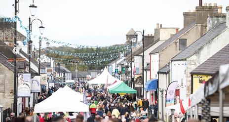 Crowds and stalls fill the main street in Bushmills