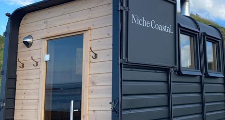 Close up of the back of the sauna, with the horsebox door open.