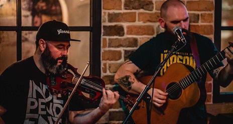 String Ninjas band performing on stage.