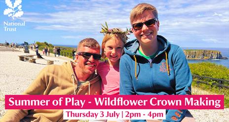 A family pictured enjoying a Wildflower Crown Making session on a sunny day at Carrick-a-Rede