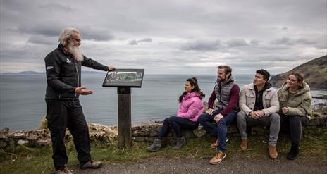 Flip shows a tour group the Game of Thrones info panel