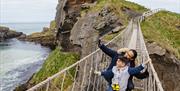 Father and Son on Carrick-a-Rede Rope Bridge taking a selfie