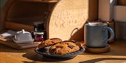 Freshly baked chocolate cookies and coffee cup