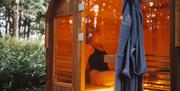 Luxury traditional sauna with branded robe