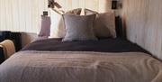 Image of the kingsize bed at the cabin.