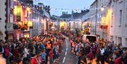 Crowds line both sides of the street for the Céilí
