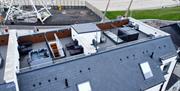 aerial view of rooftop terrace at DB Stays 'The Nest' featuring private hot tub and lounge chairs