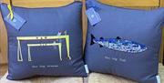 two blue handmade cushions depicting local attractions in Belfast
