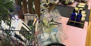 a selection of handmade cosmetics on a market stall table