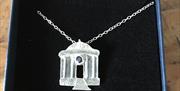 a necklace made of silver depicting Mussenden Temple