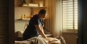 a person gets a massage at Dunluce Lodge Spa