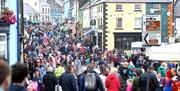 Crowds line the street in the Diamond