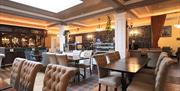 Photo of restaurant lounge with tables and chairs