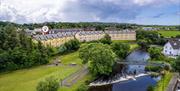 Photograph aerial view of townhouses on the River Bush