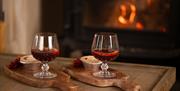 Mulled Wine and Mince Pies on Coffee Table with Wood burner Stove Lit in the Background