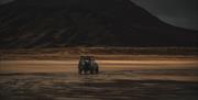 Land Rover Parked on scenic beach