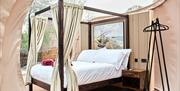 Four poster bed in a bubble dome