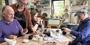 Decorating pottery with local ochre