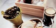 various seafood dishes sit on a table