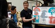 A group of people enjoying the Fidela Roastery and Coffee Tasting Tour