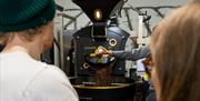 A group of people enjoying the Fidela Roastery and Coffee Tasting Tour