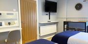 Gracehill Lodge bedroom showing TV, dressing table and dining table