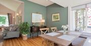 interior of living and dining area at Brown Trout's Cottage suites