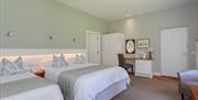 interior of double bedroom at Brown Trout's Cottage suites