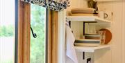 Shepherd's hut kitchen window and shelves