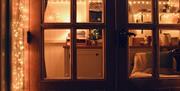 Peatlands shepherd hut doors with festive decoration.